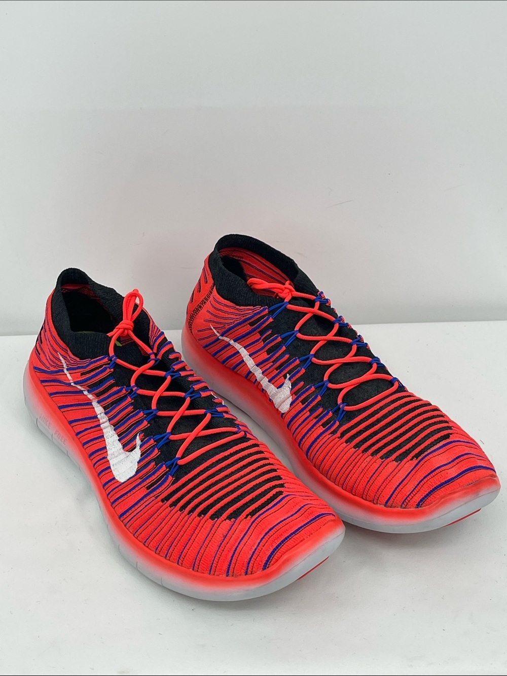 Nike Men’s Orange/Redish BLUE and Black Flyknit Athletic Shoes with White Swoos